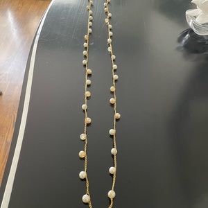 Pearl necklace on gold thread. Very long. Can be worn as double strand. Very old